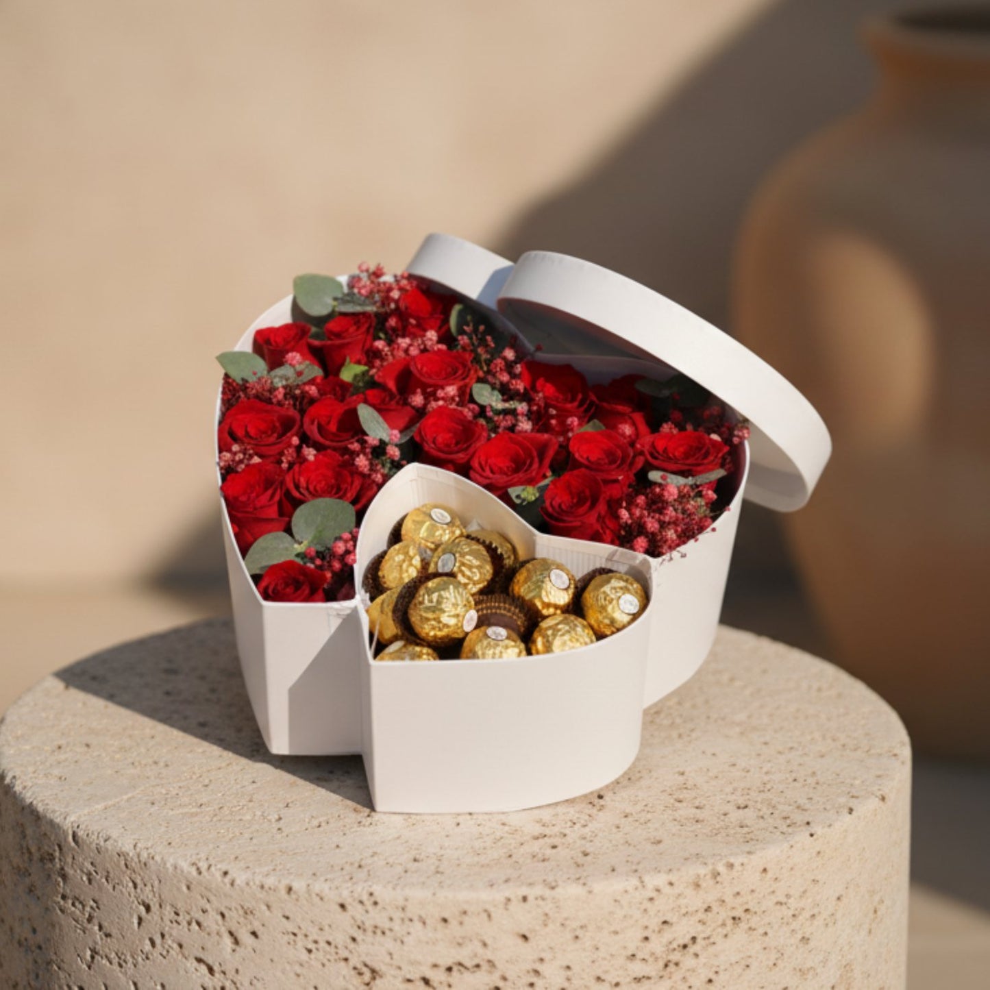 Sweet Present double heart box with red roses, red gypsophila and Ferrero Rocher chocolates.