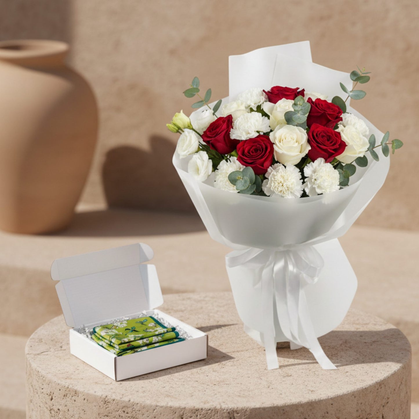 The Way She Loves bouquet with red and white roses, white carnations and eucalyptus paired with silk scarf gift box.
