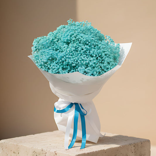 Hand-tied bouquet of blue gypsophila wrapped in elegant white paper