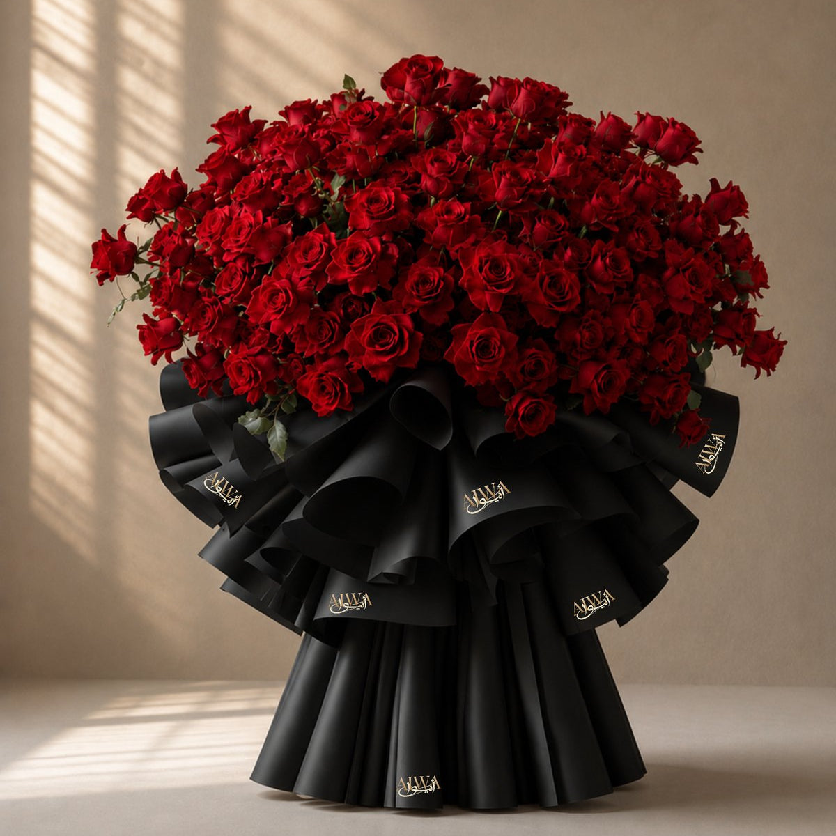 Grand dome of red roses in dramatic black AIWA wrapping - Amour Charm by AIWA Flowers