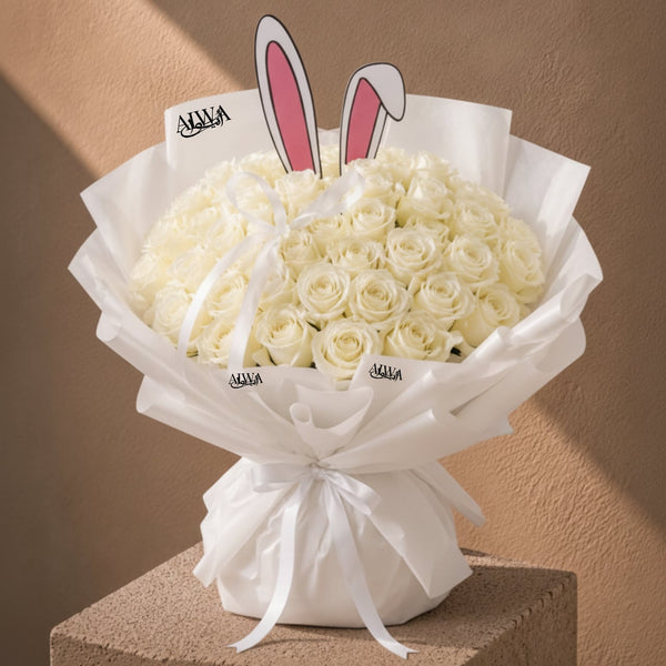 White rose bouquet with bunny ear accent by AIWA Flowers Dubai