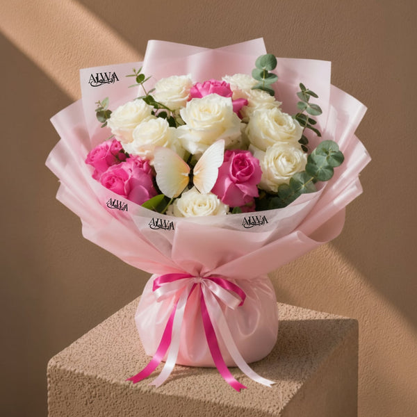 White and pink rose bouquet with butterfly detail by AIWA Flowers Dubai