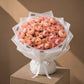 Blush pink garden rose bouquet in white wrap by AIWA Flowers Dubai