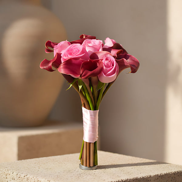 Celebration bridal bouquet with pink roses and maroon calla lily by Aiwa Flowers