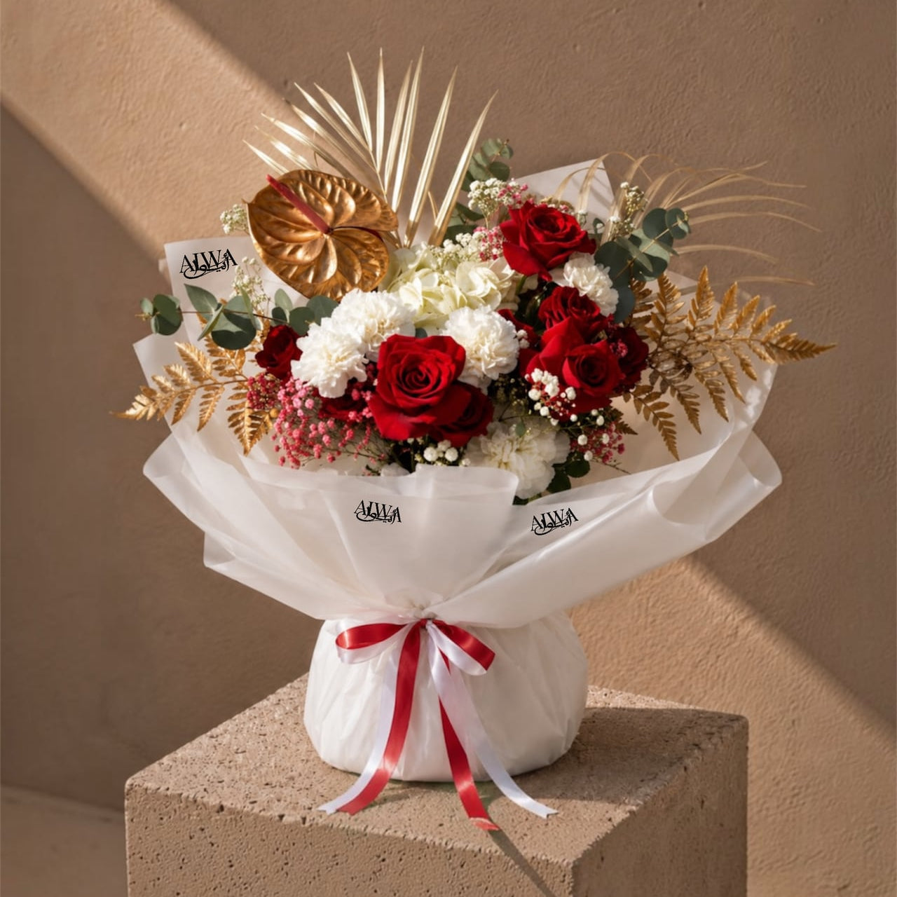 Red rose and white carnation bouquet with gold anthurium by AIWA Flowers Dubai