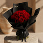 Red rose bouquet in sleek black wrapping by AIWA Flowers Dubai
