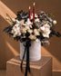 Dagger Halloween flower box of red-edged white roses and red taper candles in a grey velvet box