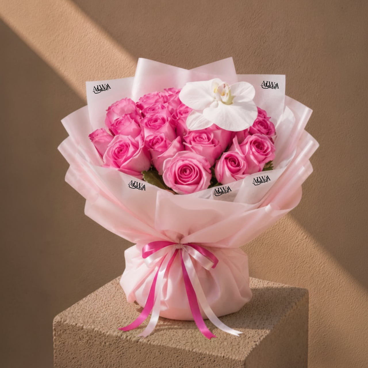 Pink rose bouquet with white orchid in pink wrap by AIWA Flowers Dubai