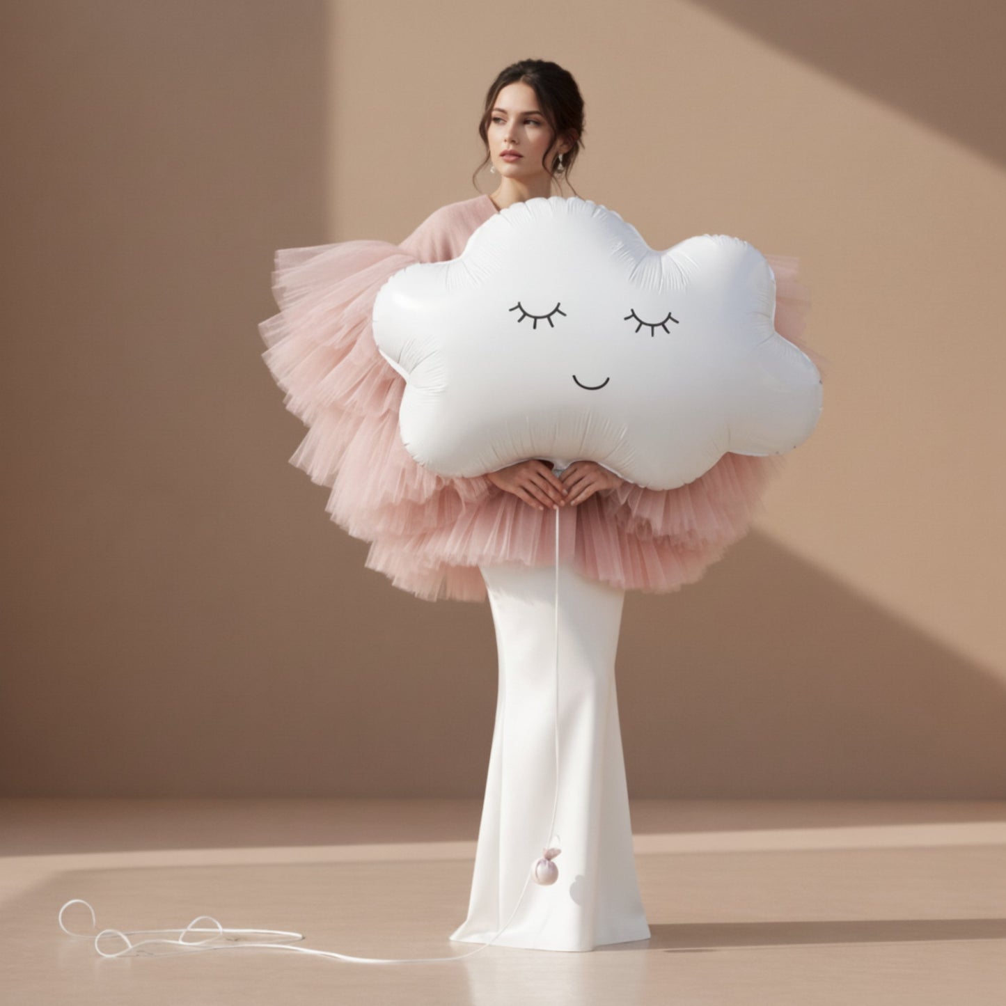 model holding large cloud helium balloon for baby shower celebration