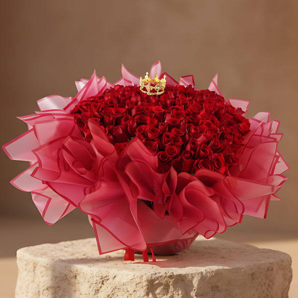 Eternal Love hand-tied bouquet with 201 red roses and crown accent in red wrapping by Aiwa Flowers