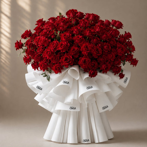Grand red rose dome bouquet in white ruffled wrap by AIWA Flowers Dubai