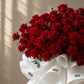Close-up of a red rose dome bouquet by AIWA Flowers Dubai