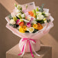 Multicolor rose and lily bouquet in pink wrap by AIWA Flowers Dubai