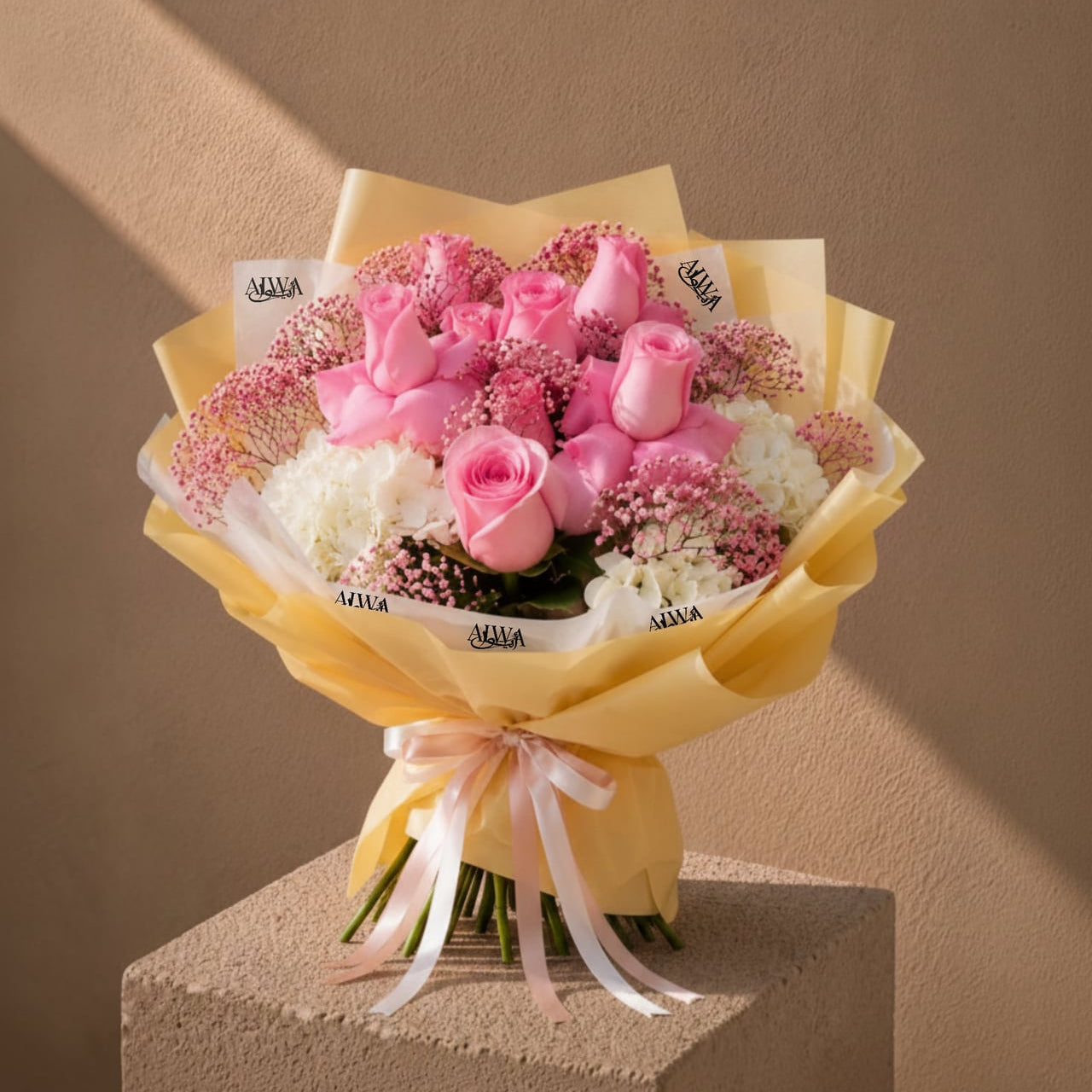 Pink rose and white hydrangea bouquet in gold wrap by AIWA Flowers Dubai