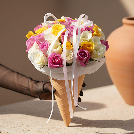 Fruit Ice Cream hand-tied bouquet with 45 white, yellow and pink roses in ice cream cone wrapping by Aiwa Flowers