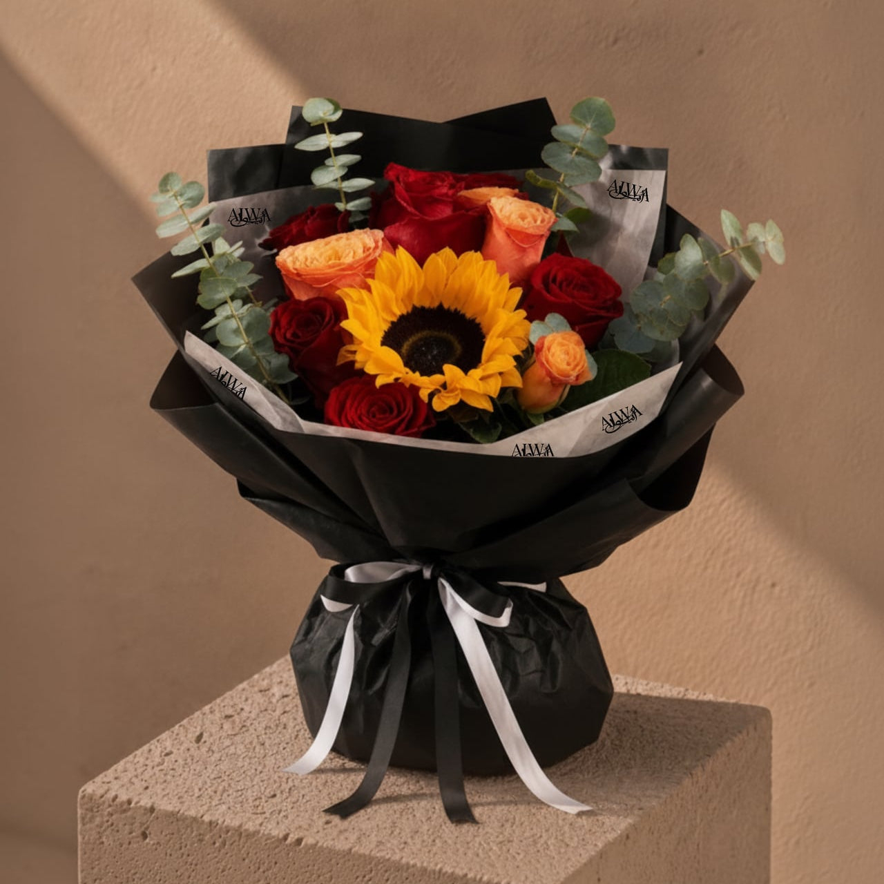 Sunflower, red and orange rose bouquet in black wrap by AIWA Flowers Dubai