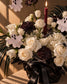 Close-up of white roses, hydrangea, black carnations and ghost picks in Ghostly Garden