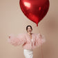 close up of glossy red heart foil balloon