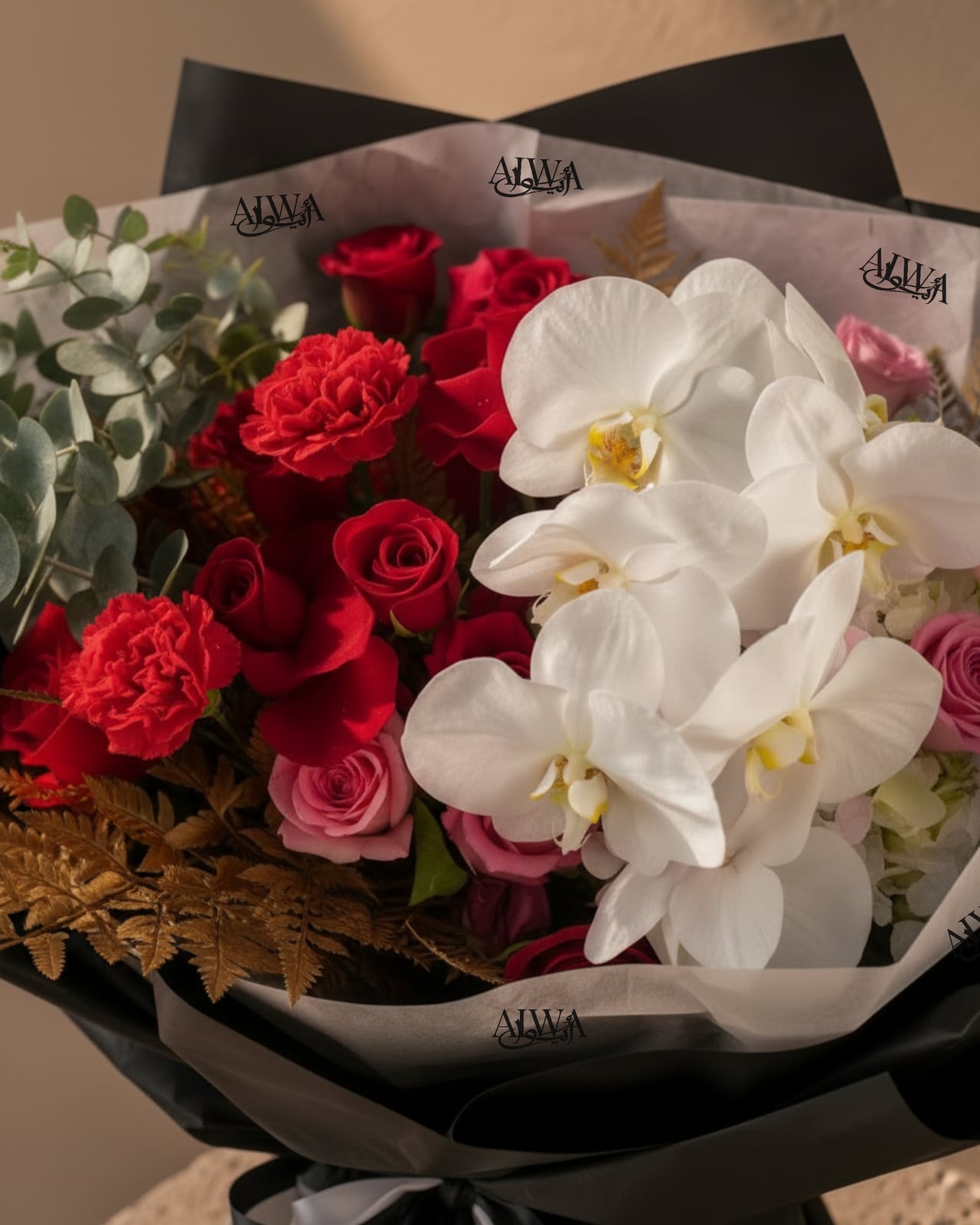 Close-up of red roses, carnations and white orchid by AIWA Flowers Dubai