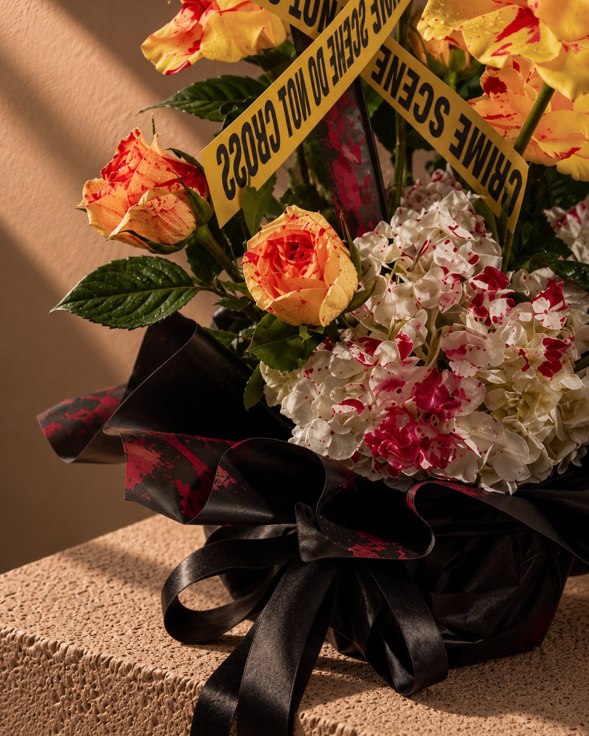 Close-up of flame-yellow roses and red-splashed white hydrangea in Haunted Harvest