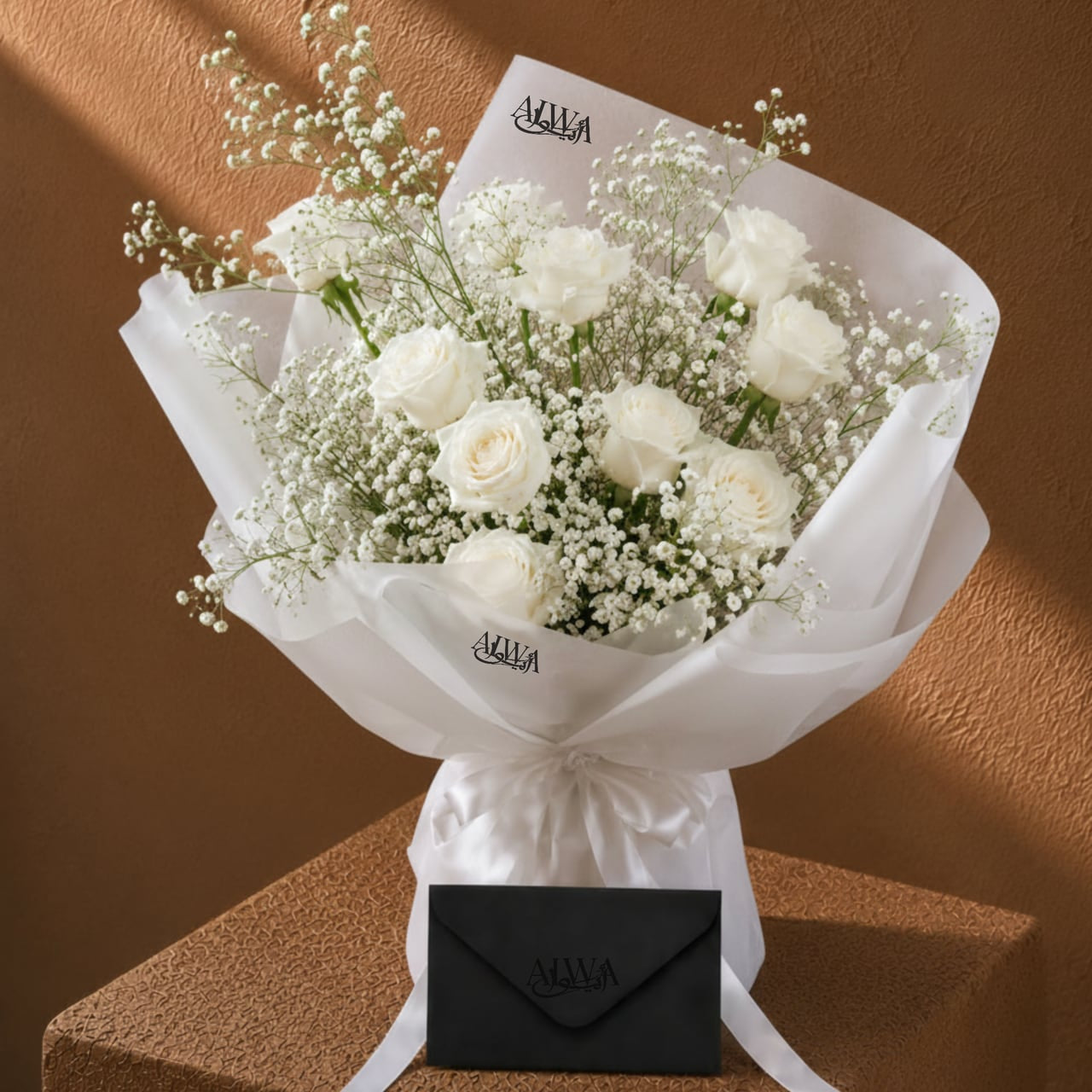 White rose bouquet in white wrap with message card by AIWA Flowers Dubai