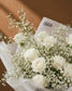 Close-up of white roses and gypsophila by AIWA Flowers Dubai