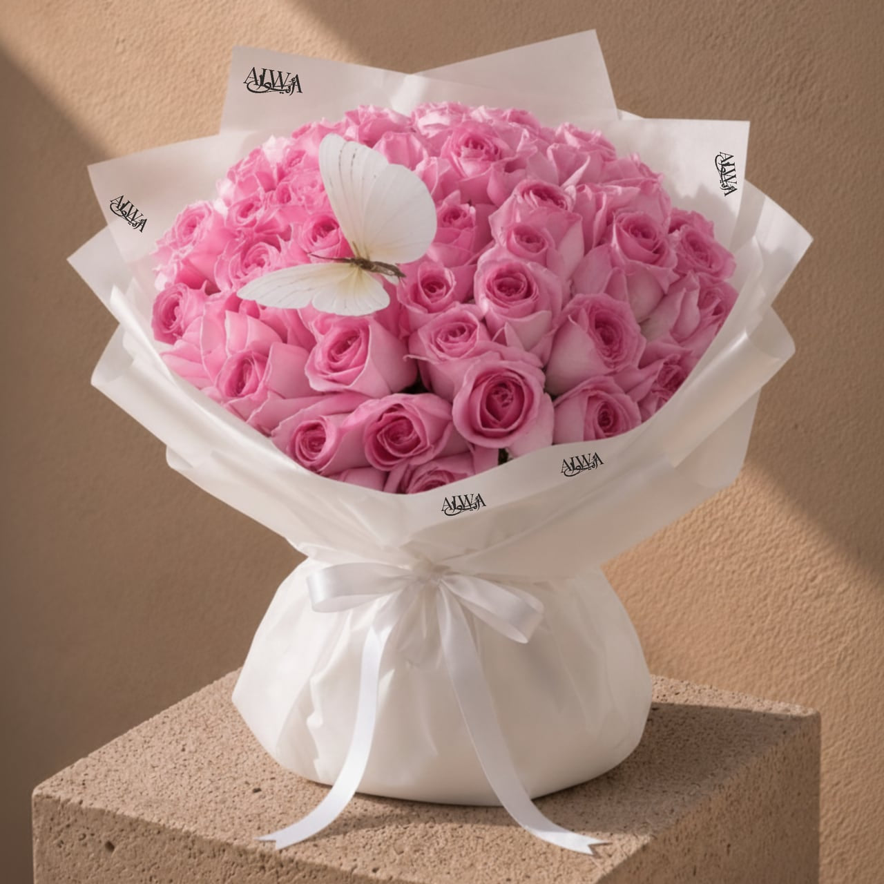 Pink rose bouquet in white wrap by AIWA Flowers Dubai