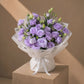 Purple lisianthus bouquet in white wrap by AIWA Flowers Dubai