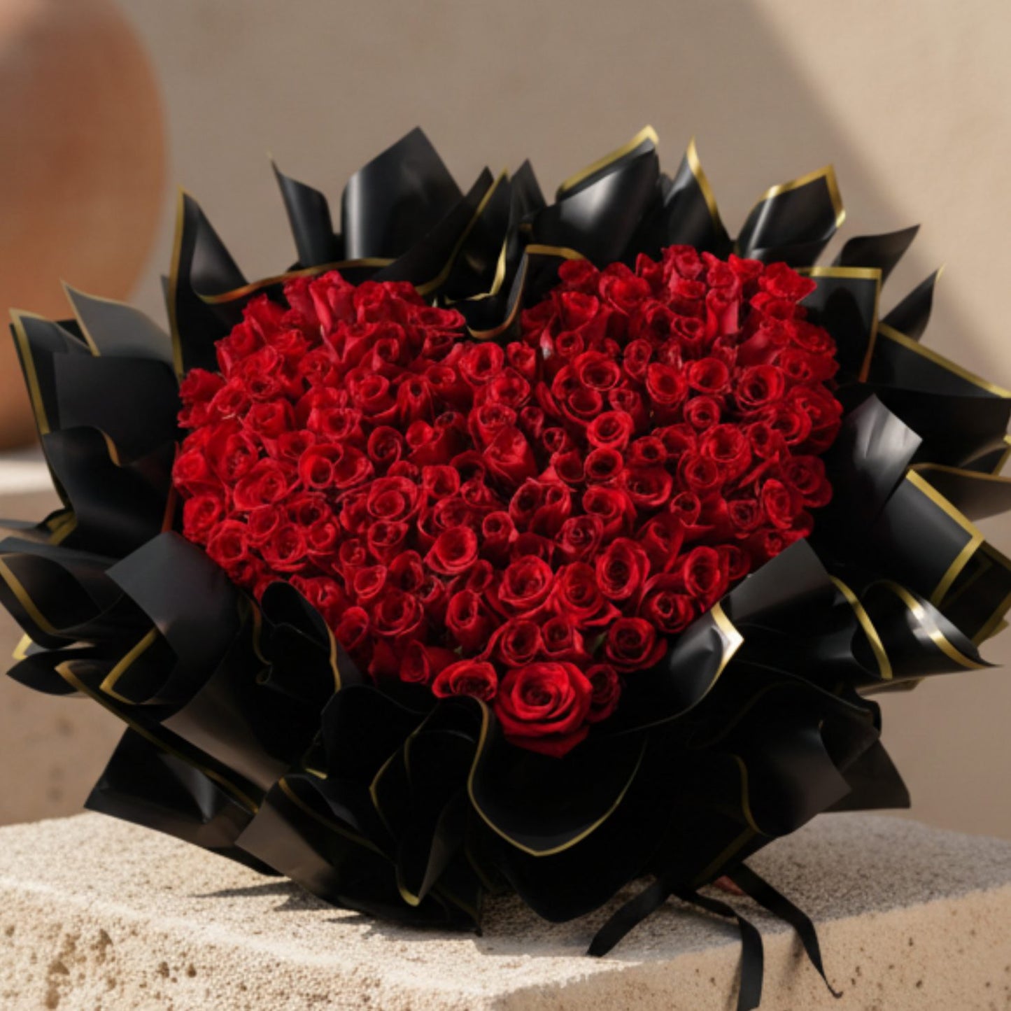 Lover’s Symphony heart-shaped bouquet with 155 fresh red roses in black wrapping