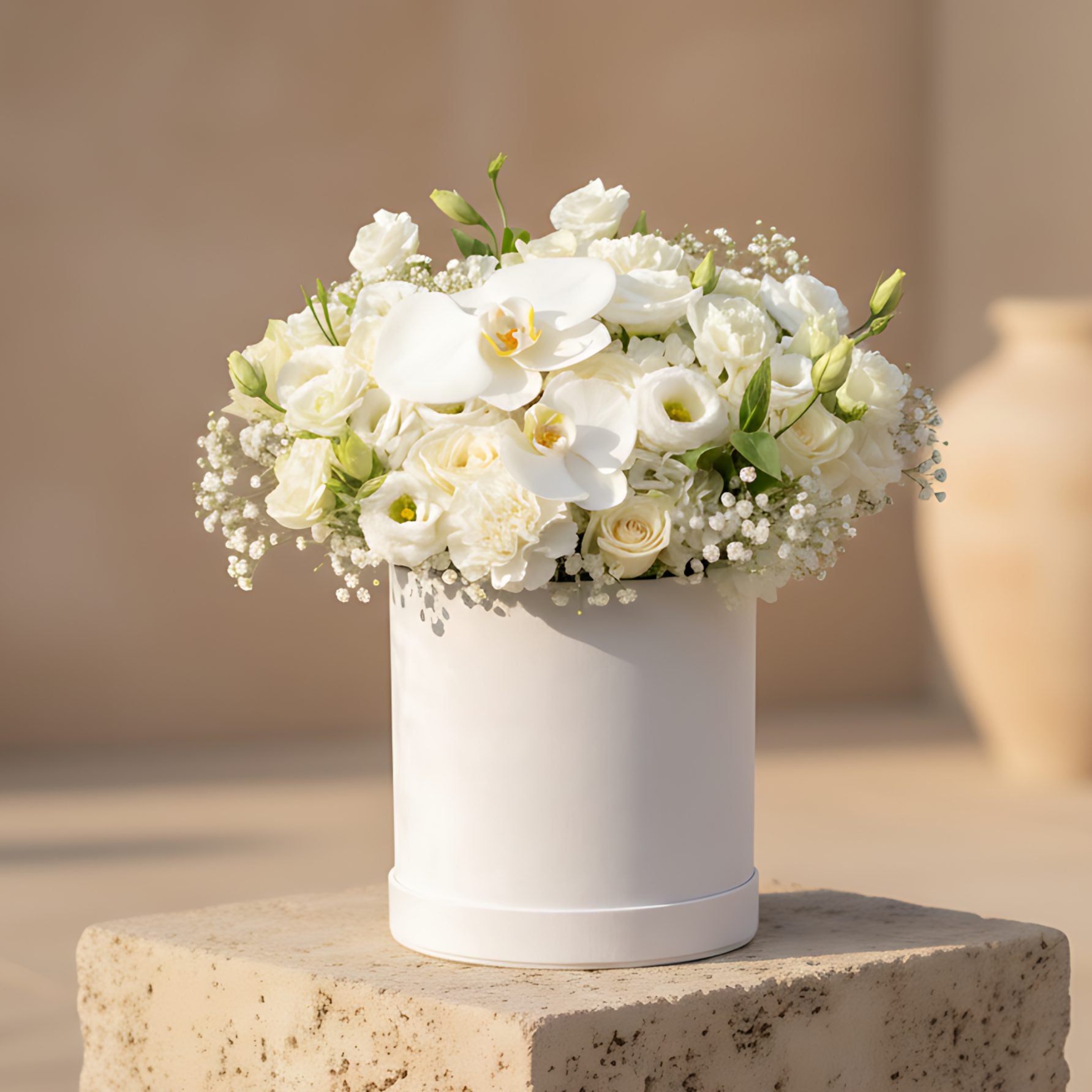 Michelangelo flower box with white roses, white carnations, orchids, hydrangea and gypsophila in a white velvet box