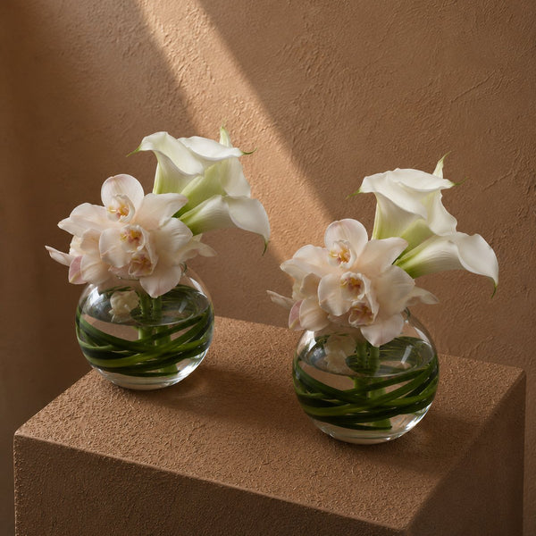 White cymbidium orchids and calla lilies in clear glass bowls - Mila by AIWA Flowers