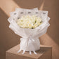 Bouquet of white roses in white AIWA wrapping with a satin ribbon - Niveous White by AIWA Flowers