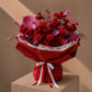 Red roses and carnations with a pink anthurium in red wrapping - Noctelle by AIWA Flowers