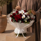 Woman holding a red rose and white orchid bouquet - Orchid Ballet by AIWA Flowers