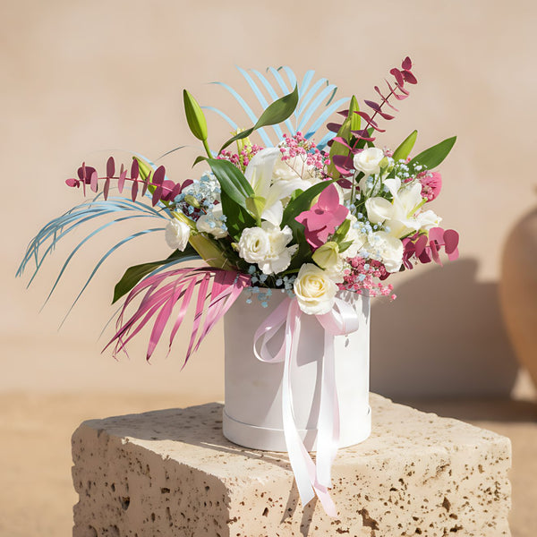Oyster white velvet flower box with white roses, lilies, hydrangea, lisianthus and pastel gypsophila