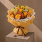 Papaya yellow rose and lily bouquet with orange gypsophila in yellow wrap by AIWA Flowers