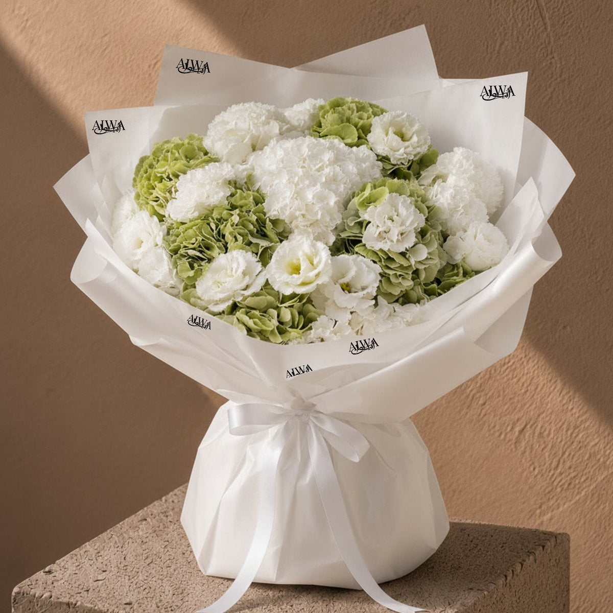 Pearl white and green bouquet with hydrangea and carnations in white wrap by AIWA Flowers