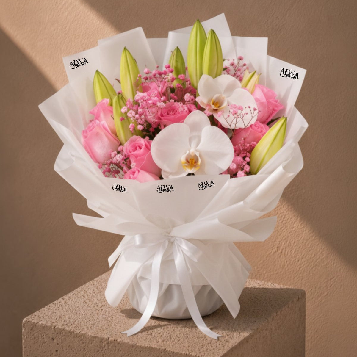 Pink Dreams pink rose, lily and white orchid bouquet in white wrapping by AIWA Flowers