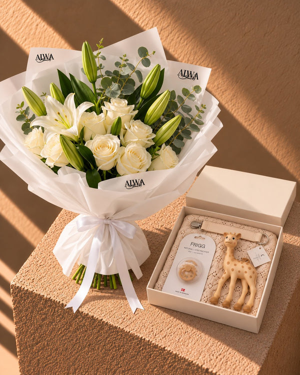 Powder Bloom baby gift set with white bouquet, giraffe teether, pacifier and knit blanket