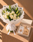 Powder Bloom baby gift set with white bouquet, giraffe teether, pacifier and knit blanket