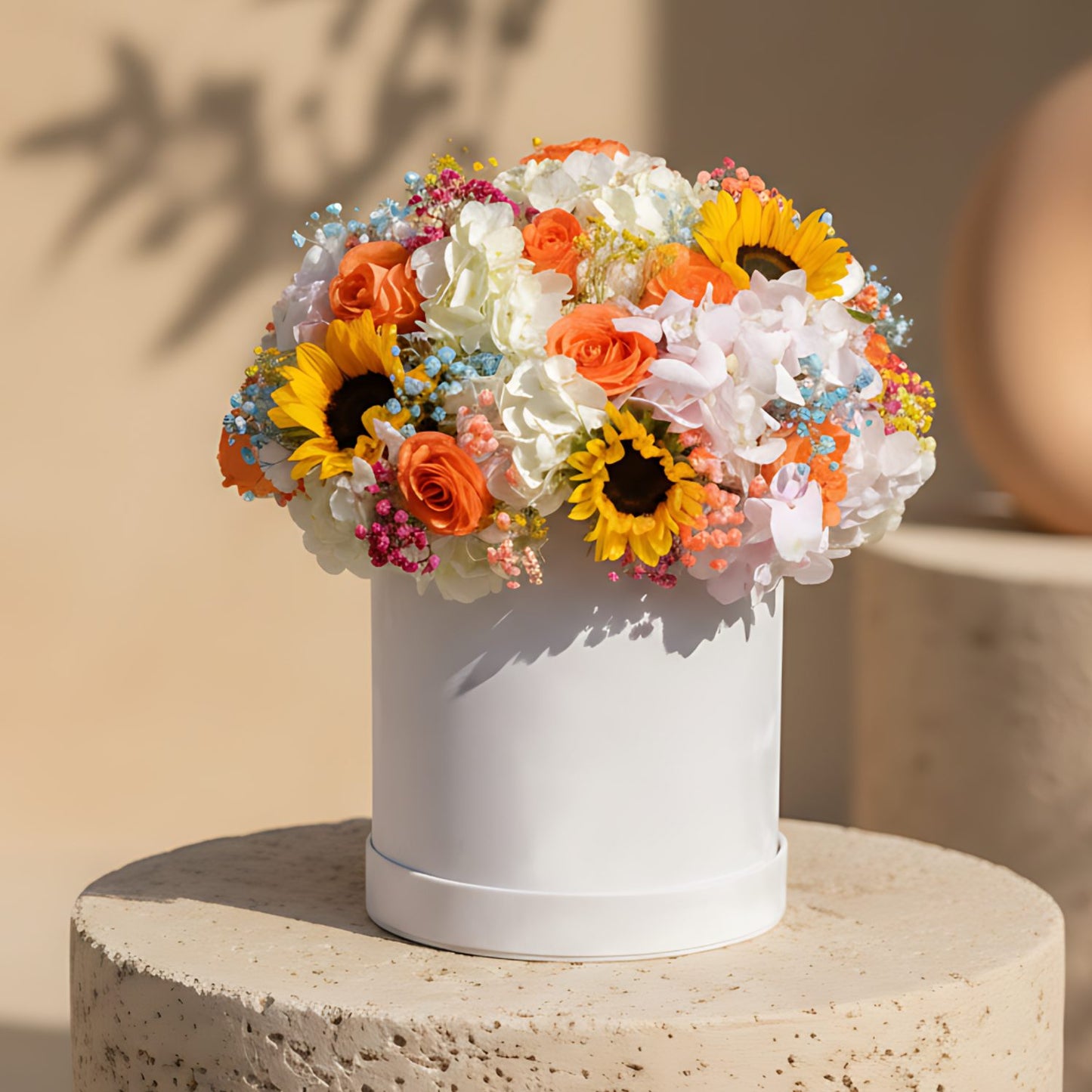 Precious white velvet flower box with white and pink hydrangeas, sunflowers, orange roses and colorful gypsophila