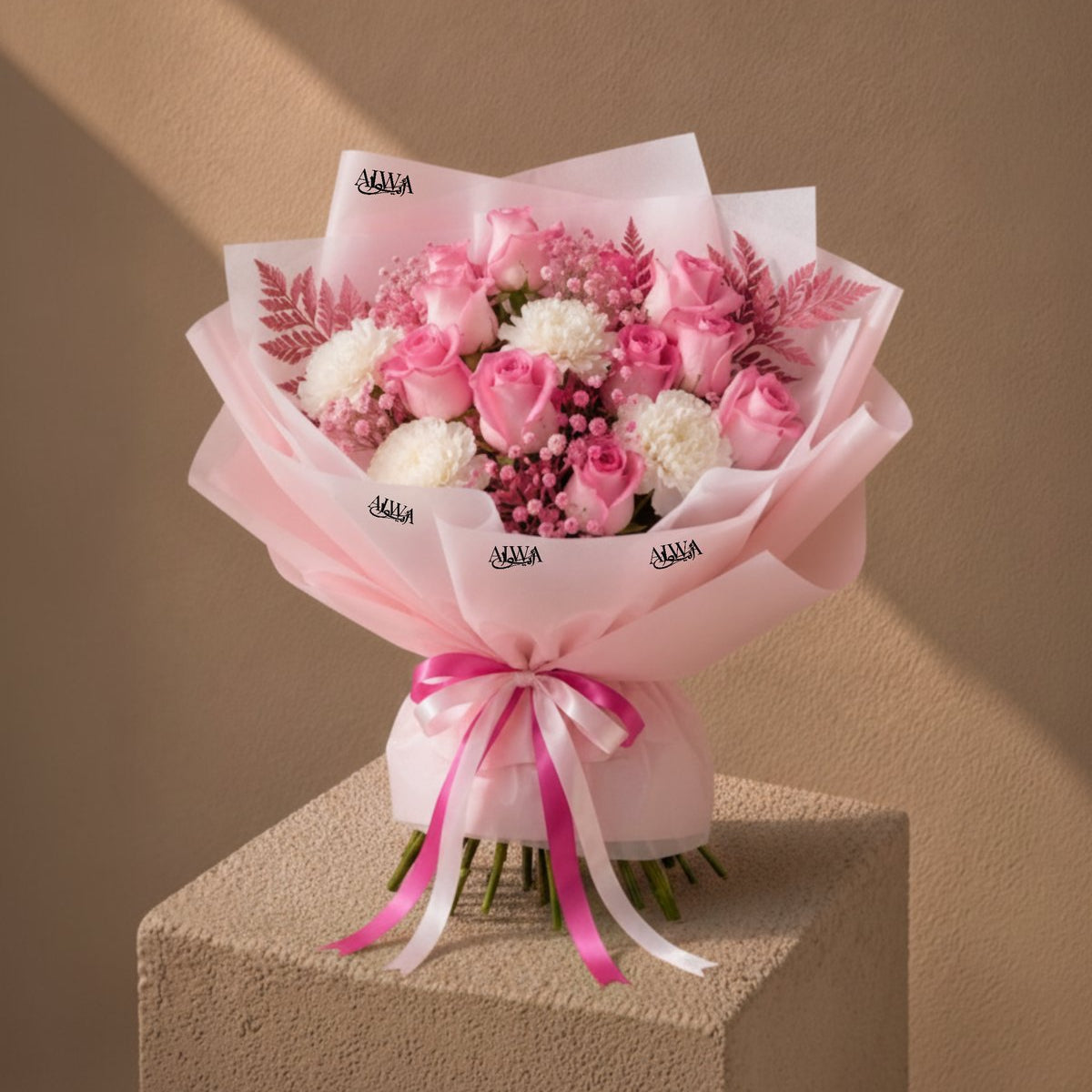 Close-up of pink roses and white carnations with pink fern by AIWA Flowers