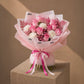 Close-up of pink roses and white carnations with pink fern by AIWA Flowers