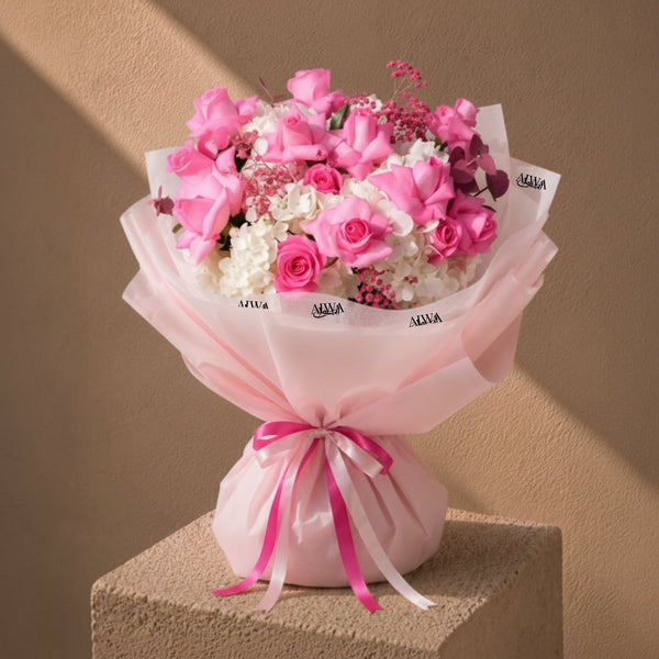 Rose Amour pink rose and white hydrangea bouquet in pink wrap by AIWA Flowers