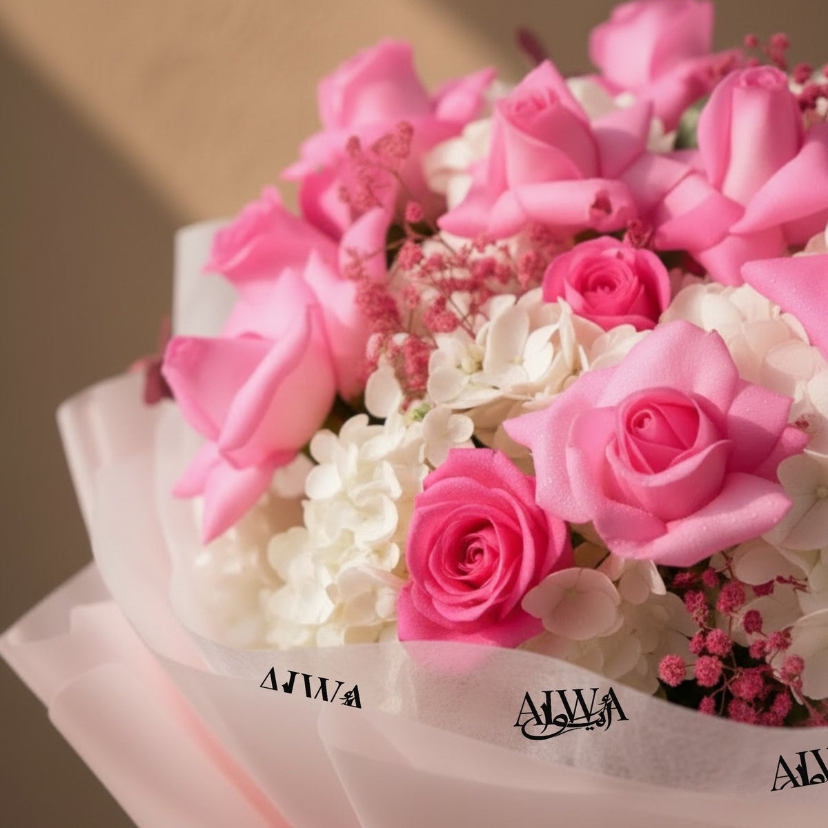 Close-up of pink roses with white hydrangea and pink gypsophila by AIWA Flowers
