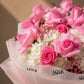 Close-up of pink roses with white hydrangea and pink gypsophila by AIWA Flowers