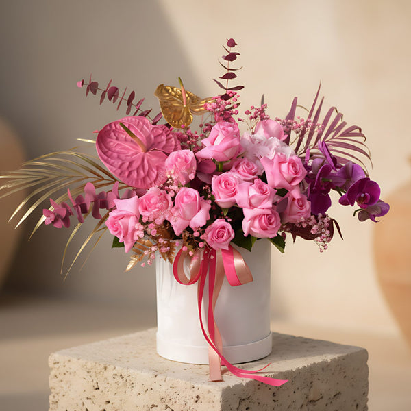 Rosewater flower box with pink roses, pink hydrangea, orchid, anthuriums and eucalyptus in a white velvet box