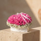 Rosy Pirouette white heart box with 55 to 65 fresh pink roses and gypsophila