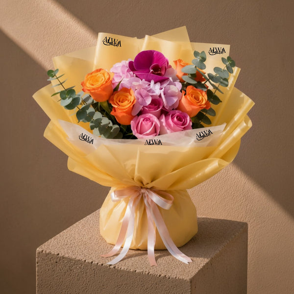 Splendor bouquet of pink and orange roses, pink hydrangea and orchid in pale yellow wrap - AIWA Flowers