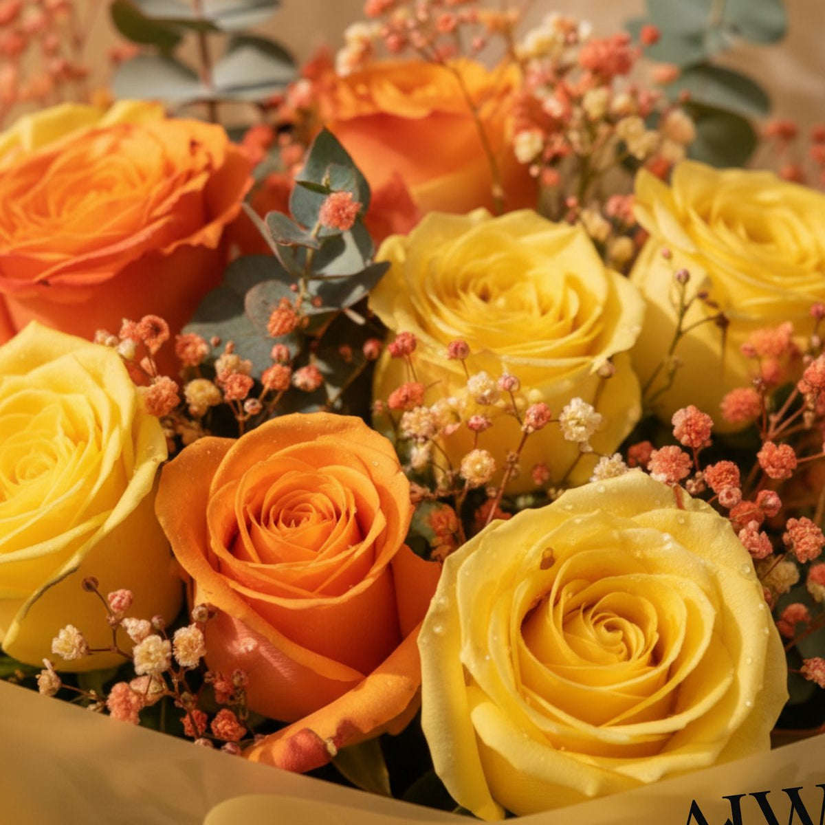 Close-up of yellow and orange roses with orange gypsophila - Summer Time by AIWA Flowers